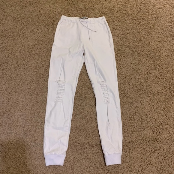 white ripped joggers